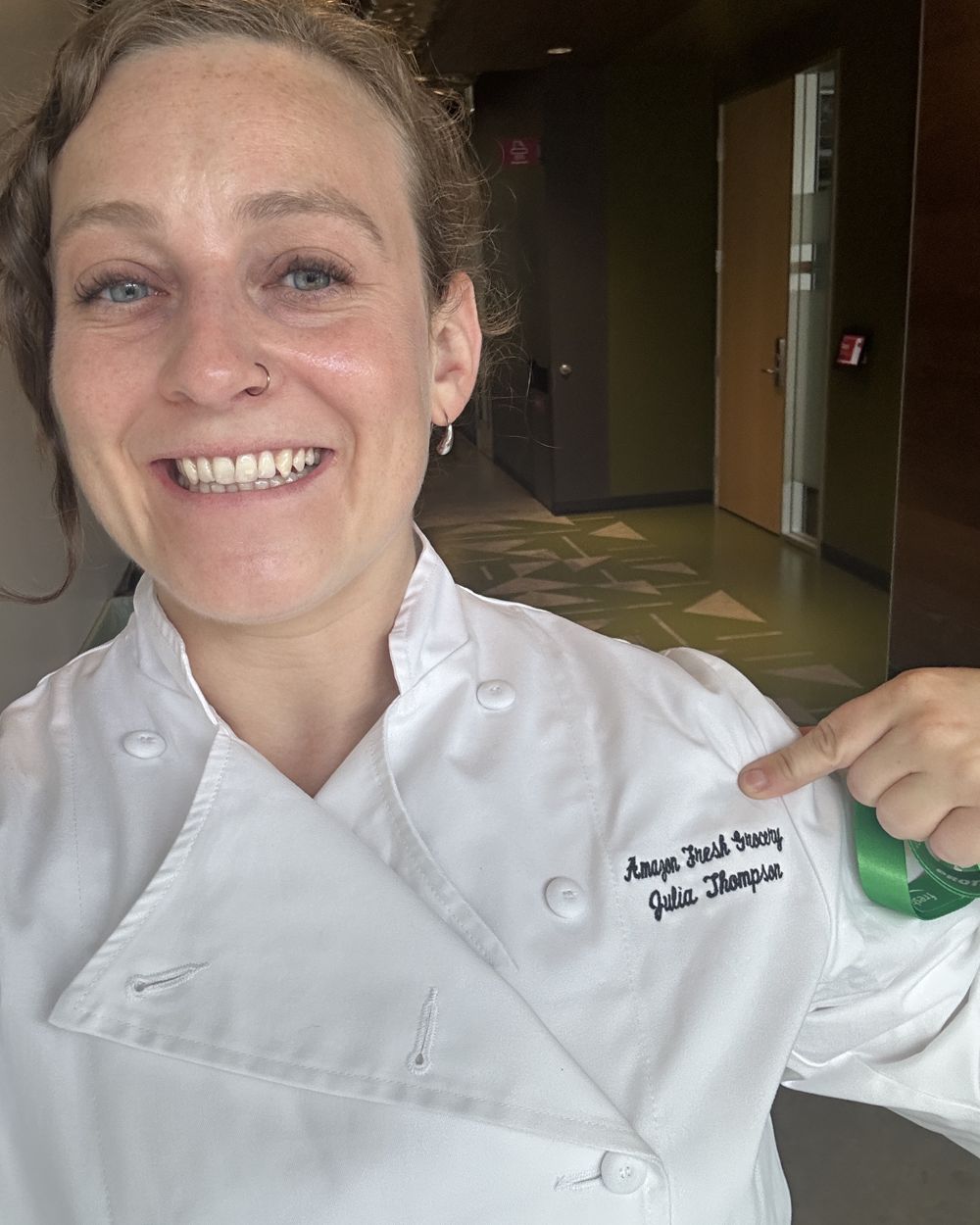 Julia in a chef's coat in a test kitchen